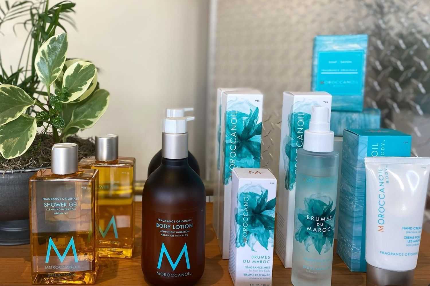 Moroccanoil products on display, including shower gel, lotion, and fragrance mist.